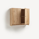 Oak cabinet with one door open, metal knobs. Shaker peg rail at bottom with black metal pegs. Door open showing woven wooden back.