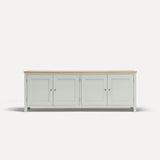 White painted four door shaker style sideboard with black metal door knobs and oak worktop.