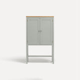 White painted two door shaker style cabinet on tall legs with oak work top.