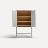 White painted two door shaker style cabinet on tall legs with oak work top. Doors open revealing oak interior and shelves.