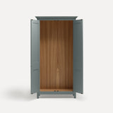Blue painted freestanding tall Armoire cupboard Shaker style with panelled doors and black metal knobs. Shown face on with both doors open.