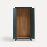 Dark Blue Grey painted freestanding tall Armoire cupboard Shaker style with panelled doors and black metal knobs. Shown face on with both doors open.