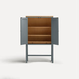 Blue painted two door shaker style cabinet on tall legs with oak work top. Doors open revealing oak interior and shelves.