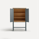 Blue painted two door shaker style cabinet on tall legs with oak work top. Doors open with sliding shelf extended.