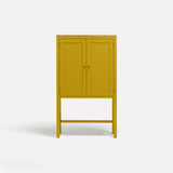 Yellow painted two door shaker style cabinet on tall legs with oak work top.
