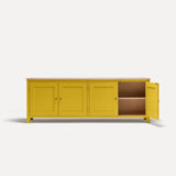 Yellow painted four door shaker style sideboard with black metal door knobs and oak worktop. One door open revealing oak interior and shelf.