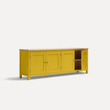 Yellow painted four door shaker style sideboard with black metal door knobs and oak worktop. Shown at angle with one door open.