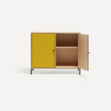 Two door ply wood contemporary side board with bold yellow painted doors (one open), black metal knobs and feet.