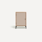 Single door ply wood contemporary bedside cabinet with painted pink door, black metal door knobs and black metal legs.