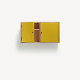 Two door ply wood contemporary wall cupboard with bold yellow painted doors (one open showing internal shelf), black metal door knobs.