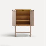 Pink painted two door shaker style cabinet on tall legs with oak work top. Doors open sliding shelf extended.