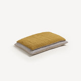 Dog bed ochre linen topper on cotton ticking stripe floor cushion.