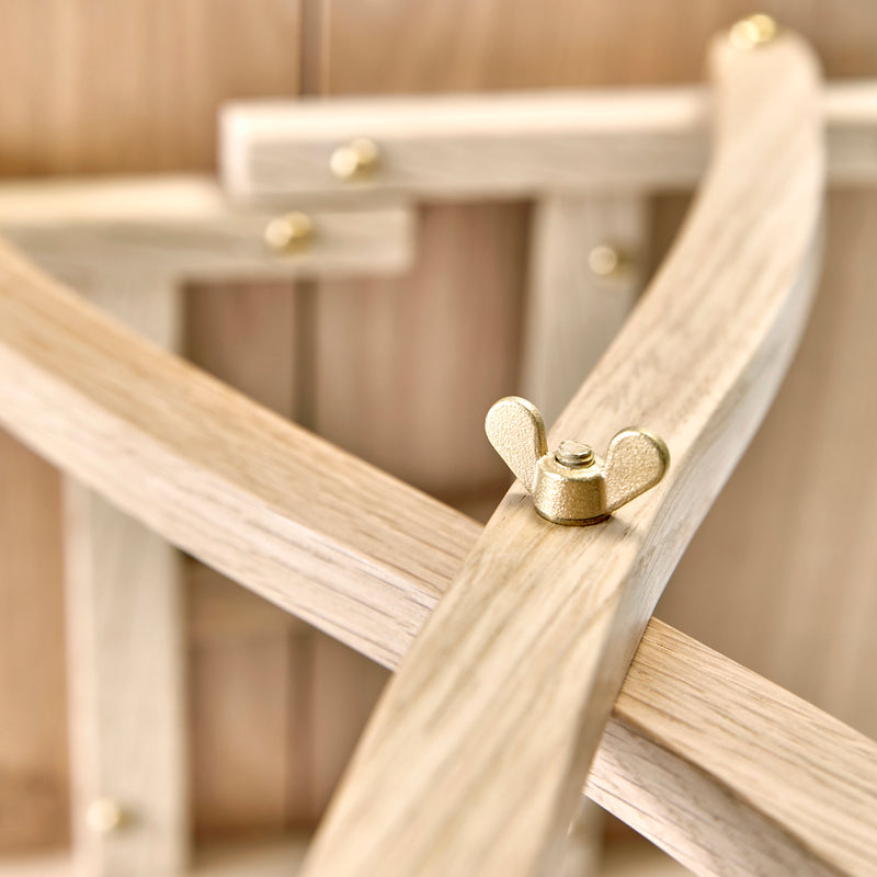 Detail of locking brass wing nuts on table legs