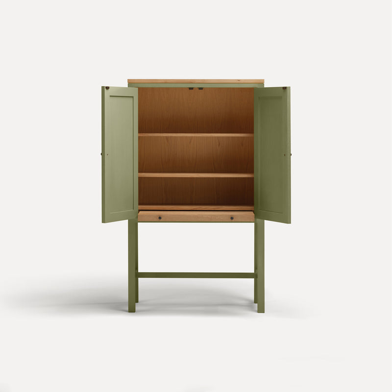 Green painted two door shaker style cabinet on tall legs with oak work top. Doors open revealing oak interior and sliding shelf extended.