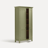 Tall freestanding wooden Shaker style two door cupboard with cornice and wooden legs, painted apple green. One door open revealing four shelves and oak interior.