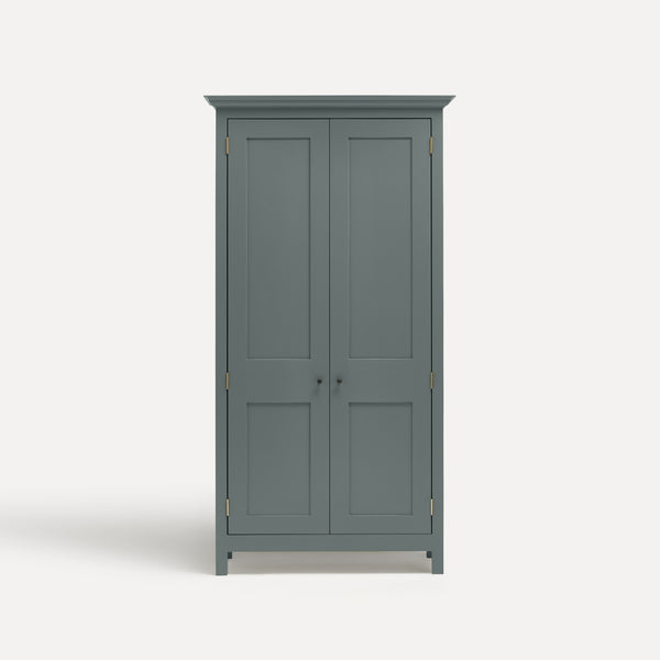 Blue Grey painted freestanding tall cupboard Shaker style with panelled doors black metal knobs.