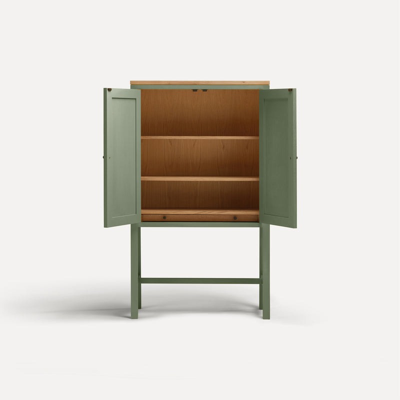 Green painted two door shaker style cabinet on tall legs with oak work top.  Doors open revealing oak interior and shelves.