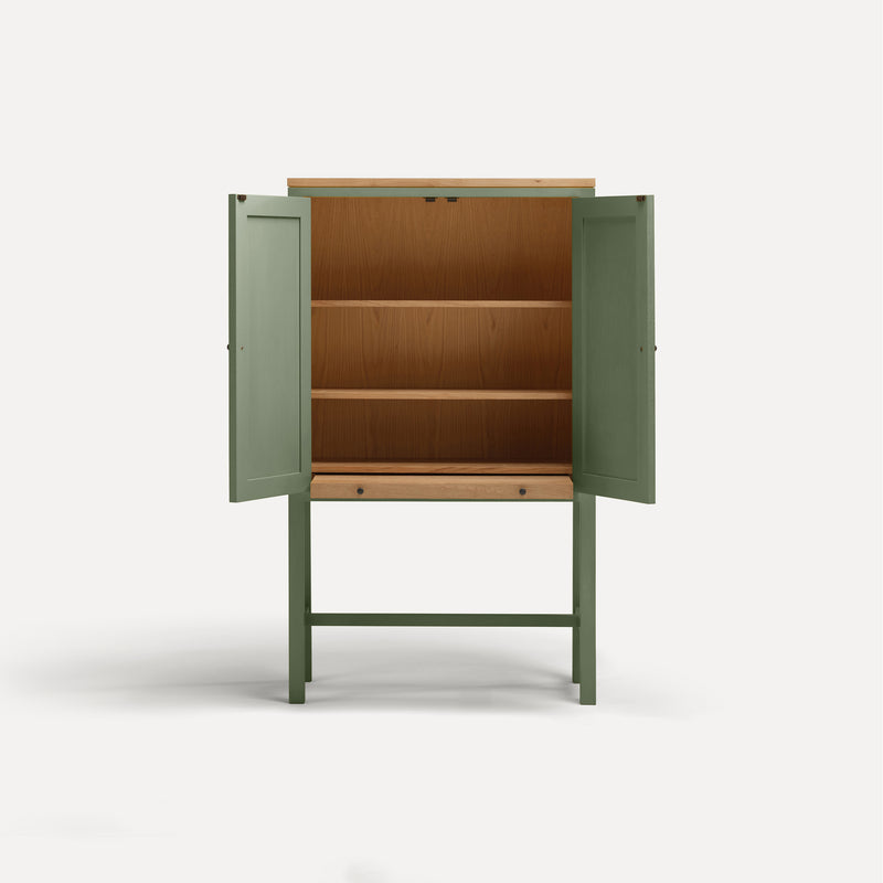 Green painted two door shaker style cabinet on tall legs with oak work top.  Doors open sliding shelf extended.