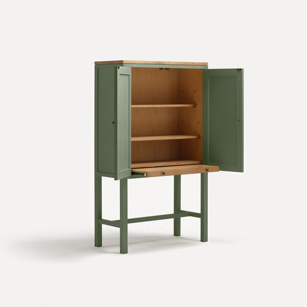 Green painted two door shaker style cabinet on tall legs with oak work top.  Shown at angle doors open sliding shelf extended.