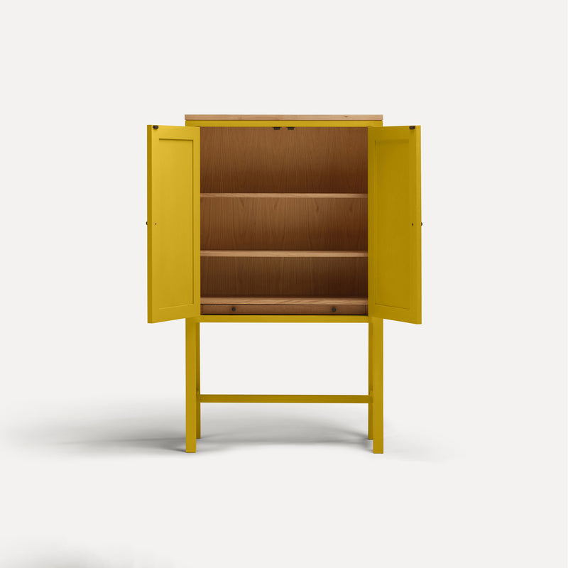 Yellow painted two door shaker style cabinet on tall legs with oak work top.  Doors open revealing oak interior and shelves.