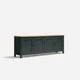 Grey Blue painted four door shaker style sideboard with black metal door knobs and oak worktop. Shown at an angle.