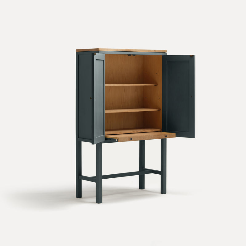 Blue Grey painted two door shaker style cabinet on tall legs with oak work top. Doors open sliding shelf extended.
