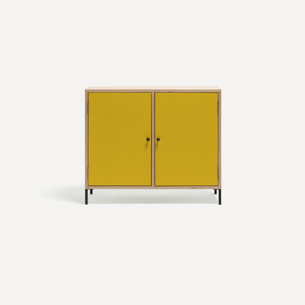 Two door ply wood contemporary side board with bold yellow painted doors, black metal knobs and feet. 