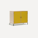 Two door ply wood contemporary side board with bold yellow painted doors, black metal knobs and feet. Shown at an angle.