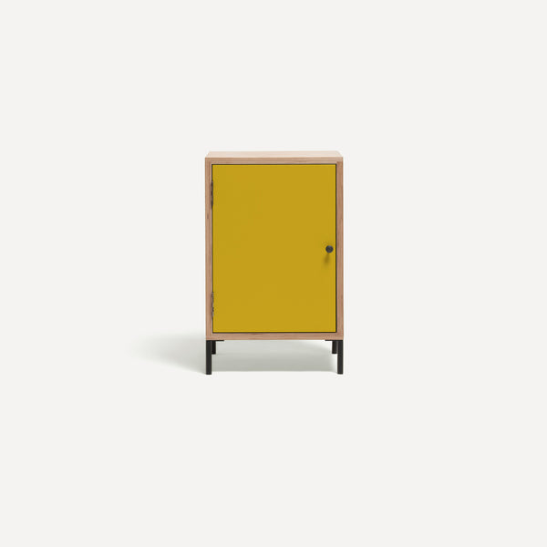 Single door ply wood contemporary bedside cabinet with bold yellow painted door, black metal door knobs and black metal legs