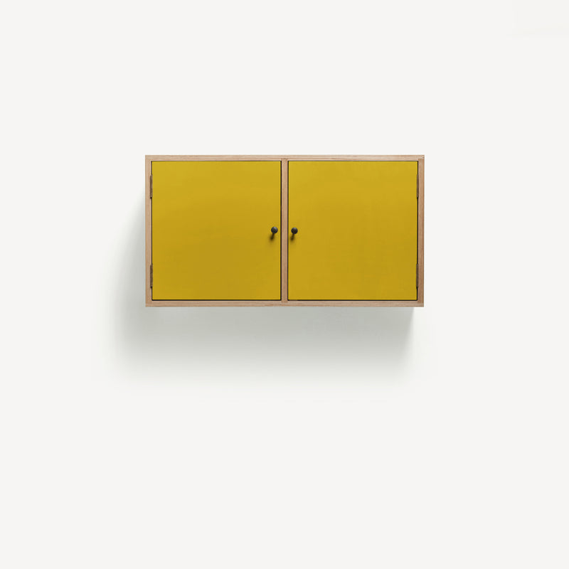 Two door ply wood contemporary wall cupboard with bold yellow painted doors, black metal door knobs. 