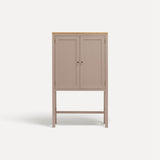 Pink painted two door shaker style cabinet on tall legs with oak work top. 