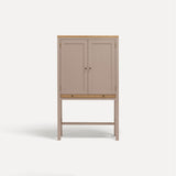 Pink painted two door shaker style cabinet on tall legs with oak work top. 